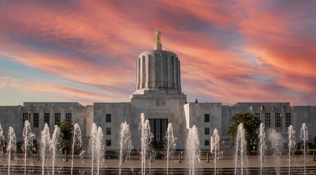 oregon state capitol at sunset with water fountains in front