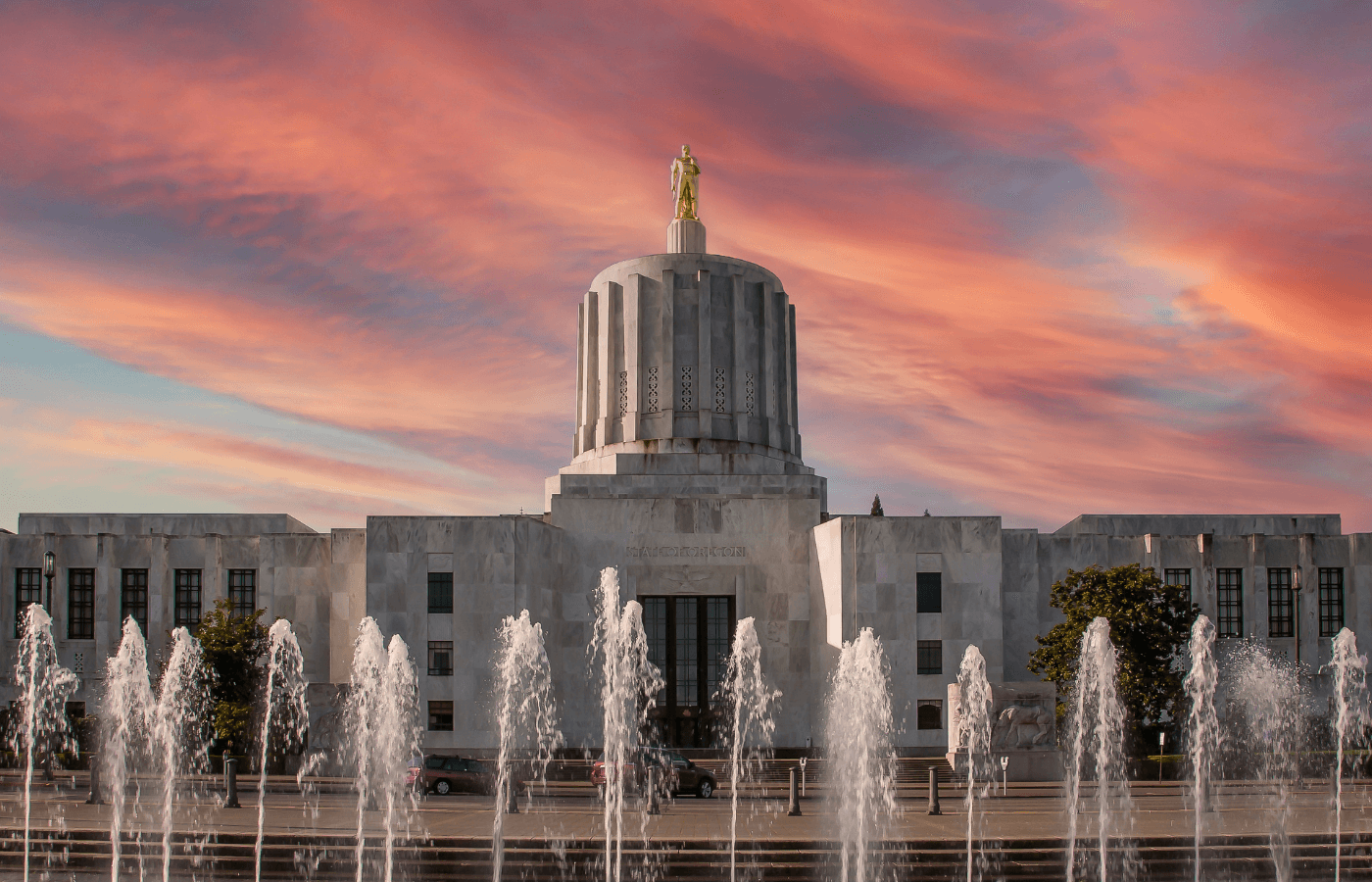 oregon state capitol at sunset with water fountains in front