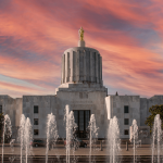oregon state capitol at sunset with water fountains in front
